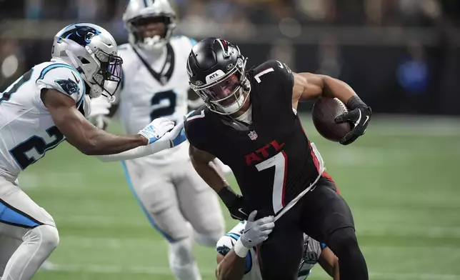 Atlanta Falcons running back Bijan Robinson runs against the Carolina Panthers during the first half of an NFL football game, Sunday, Jan. 5, 2025, in Atlanta. (AP Photo/Brynn Anderson)