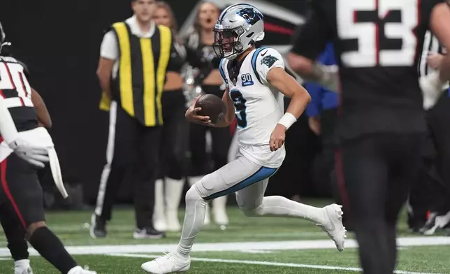 Carolina Panthers quarterback Bryce Young scores against the Atlanta Falcons during the second half of an NFL football game, Sunday, Jan. 5, 2025, in Atlanta. (AP Photo/Brynn Anderson)