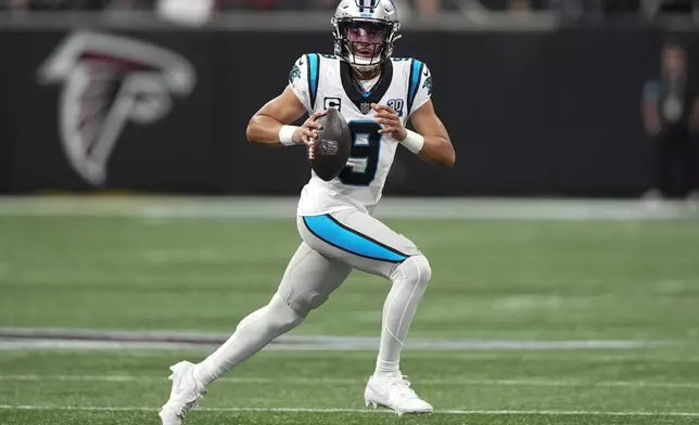 Carolina Panthers quarterback Bryce Young looks to pass against the Atlanta Falcons during the first half of an NFL football game, Sunday, Jan. 5, 2025, in Atlanta. (AP Photo/Brynn Anderson)