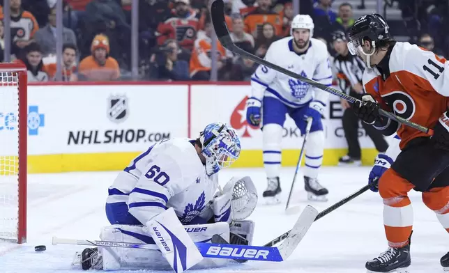 Toronto Maple Leafs' Joseph Woll (60) cannot stop a goal by Philadelphia Flyers' Travis Konecny (11) during the second period of an NHL hockey game, Tuesday, Jan. 7, 2025, in Philadelphia. (AP Photo/Matt Slocum)