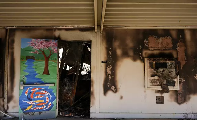 The entrance to a classroom is seen at Palisades High School in the aftermath of the Palisades Fire in the Pacific Palisades neighborhood of Los Angeles, Tuesday, Jan. 14, 2025. (AP Photo/Carolyn Kaster)