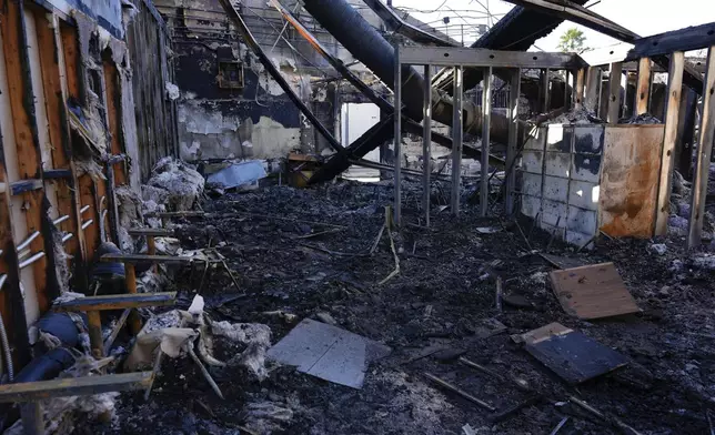 The inside of a classroom is seen at Palisades High School in the aftermath of the Palisades Fire in the Pacific Palisades neighborhood of Los Angeles, Tuesday, Jan. 14, 2025. (AP Photo/Carolyn Kaster)