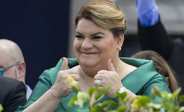 Jenniffer Gonzalez Colon gives a thumbs up during her swearing-in ceremony as governor outside the Capitol in San Juan, Puerto Rico, Thursday, Jan. 2, 2025. (AP Photo/Alejandro Granadillo)