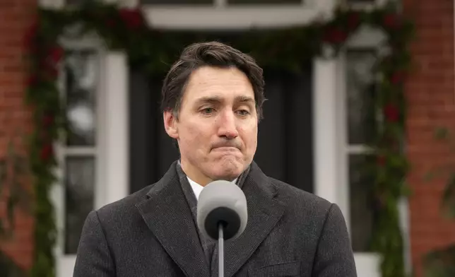 Canada Prime Minister Justin Trudeau makes an announcement outside Rideau Cottage in Ottawa on Monday, Jan. 6, 2025. (Adrian Wyld/The Canadian Press via AP)