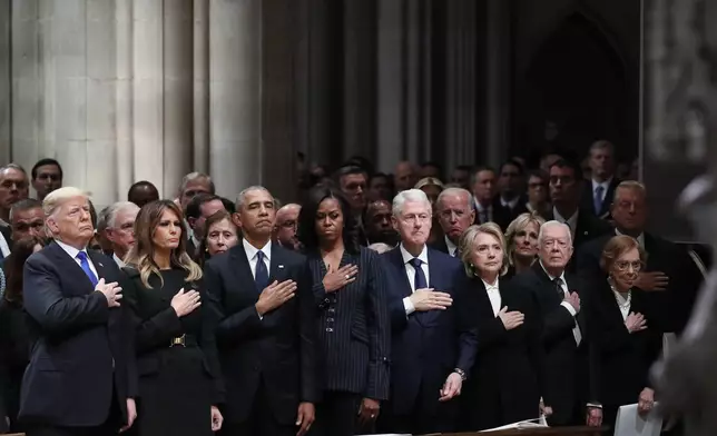 FILE - From left, President Donald Trump, first lady Melania Trump, former President Barack Obama, former first lady Michelle Obama, former President Bill Clinton, former Secretary of State Hillary Clinton, former President Jimmy Carter and former first lady Rosalynn Carter participate in the State Funeral for former President George H.W. Bush at the National Cathedral on Dec. 5, 2018, in Washington. (AP Photo/Alex Brandon, Pool, File)