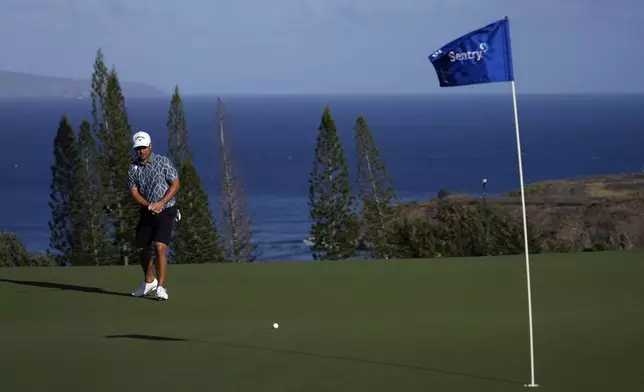 Xander Schauffele follows his shot on the 11th green during the pro-am round of The Sentry golf event, Wednesday, Jan. 1, 2025, at Kapalua Plantation Course in Kapalua, Hawaii. (AP Photo/Matt York)