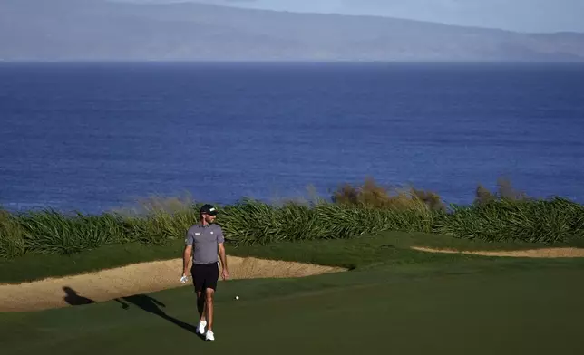 Max Homa reads the 12th green during the pro-am round of The Sentry golf event, Wednesday, Jan. 1, 2025, at Kapalua Plantation Course in Kapalua, Hawaii. (AP Photo/Matt York)