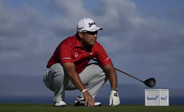 Hideki Matsuyama, of Japan, watches his shot from the 13th tee during the pro-am round of The Sentry golf event, Wednesday, Jan. 1, 2025, at Kapalua Plantation Course in Kapalua, Hawaii. (AP Photo/Matt York)