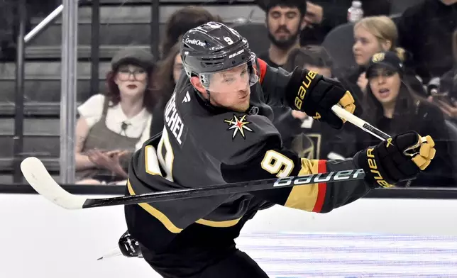 Vegas Golden Knights center Jack Eichel (9) breaks his stick attempting to take a shot against the Philadelphia Flyers during the second period of an NHL hockey game Thursday, Jan. 2, 2025, in Las Vegas. (AP Photo/David Becker)