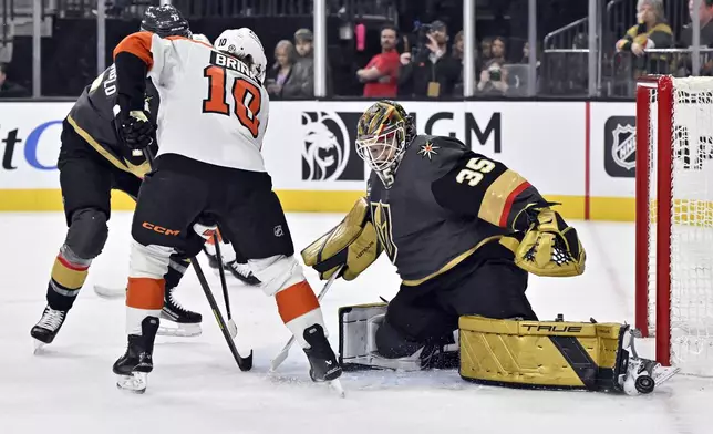 Vegas Golden Knights goaltender Ilya Samsonov (35) blocks a shot with his skate by Philadelphia Flyers right wing Bobby Brink (10) during the first period of an NHL hockey game Thursday, Jan. 2, 2025, in Las Vegas. (AP Photo/David Becker)