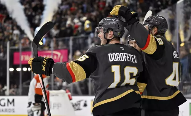 Vegas Golden Knights left wing Pavel Dorofeyev (16) celebrates after scoring against the Philadelphia Flyers during the second period of an NHL hockey game Thursday, Jan. 2, 2025, in Las Vegas. (AP Photo/David Becker)