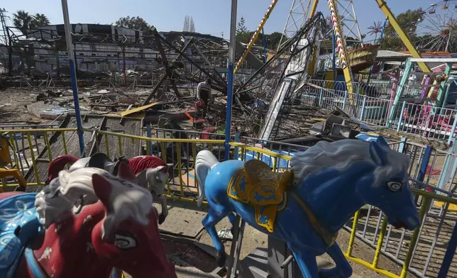 A man looks at the damages at an amusement park that was hit Tuesday night by an Israeli airstrike, in Nabatiyeh town, southern Lebanon, Wednesday, Jan. 29, 2025. (AP Photo/Mohammed Zaatari)