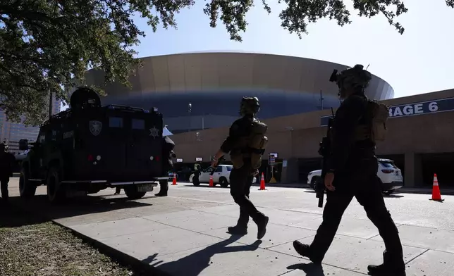 Local SWAT teams patrol outside the Caesars Superdome ahead of the Sugar Bowl NCAA College Football Playoff game, Thursday, Jan. 2, 2025, in New Orleans. (AP Photo/Butch Dill)