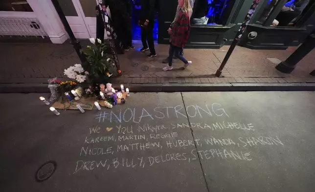 A memorial on Bourbon Street is seen at the site of a deadly truck attack on New Year's Day in New Orleans, Friday, Jan. 3, 2025. (AP Photo/Gerald Herbert)