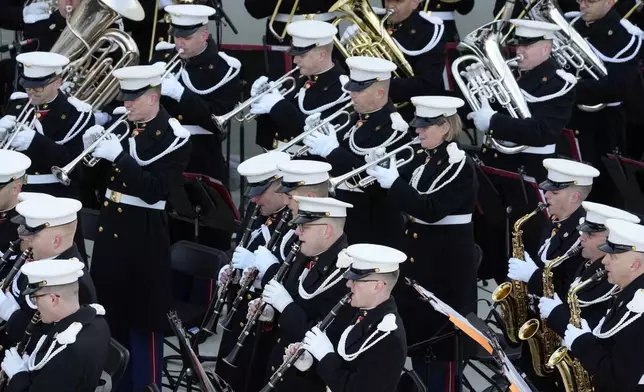 Members of the the U.S. Marine Band, "The President's Own," play during a rehearsal on the West Front of the U.S. Capitol ahead of President-elect Donald Trump's upcoming inauguration, Sunday, Jan. 12, 2025, in Washington. (AP Photo/Jon Elswick)