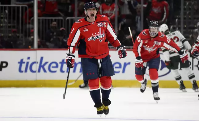 Washington Capitals left wing Alex Ovechkin (8) celebrates his goal during the second period of an NHL hockey game against the Minnesota Wild, Thursday, Jan. 2, 2025, in Washington. (AP Photo/Nick Wass)