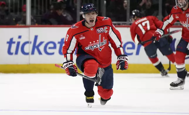 Washington Capitals left wing Alex Ovechkin (8) celebrates his goal during the second period of an NHL hockey game against the Minnesota Wild, Thursday, Jan. 2, 2025, in Washington. (AP Photo/Nick Wass)