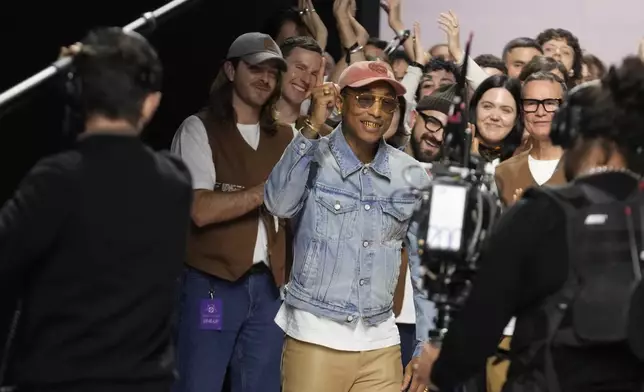 Pharrell Williams reacts after the men's Louis Vuitton Fall-Winter 2025-2026 collection, that was presented in Paris, Tuesday, Jan. 21, 2025. (AP Photo/Michel Euler)