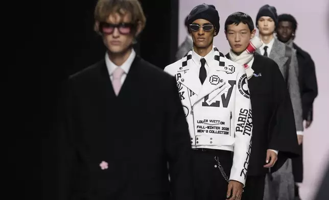 Models wear creations as part of the men's Louis Vuitton Fall-Winter 2025-2026 collection, that was presented in Paris, Tuesday, Jan. 21, 2025. (AP Photo/Michel Euler)