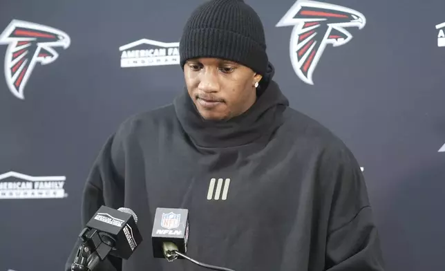 Atlanta Falcons quarterback Michael Penix Jr. talks to reporters after an NFL football game against the Washington Commanders, Sunday, Dec. 29, 2024, in Landover, Md. The Commanders won 30-24. (AP Photo/Stephanie Scarbrough)