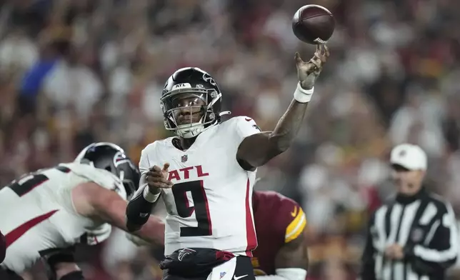 Atlanta Falcons quarterback Michael Penix Jr. (9) passes during the first half of an NFL football game against the Washington Commanders, Sunday, Dec. 29, 2024, in Landover. (AP Photo/Stephanie Scarbrough)