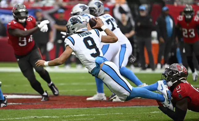 Carolina Panthers quarterback Bryce Young is sacked by Tampa Bay Buccaneers linebacker Yaya Diaby during the second half of an NFL football game Sunday, Dec. 29, 2024, in Tampa, Fla. (AP Photo/Jason Behnken)