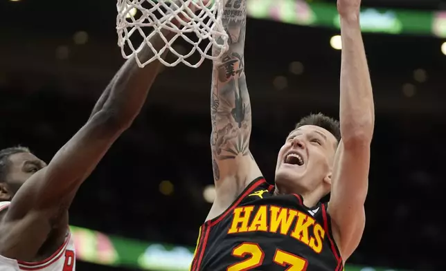 Chicago Bulls forward Patrick Williams (44), left, fouls Atlanta Hawks guard Vit Krejci (27) during the first half of an NBA basketball game Wednesday, Jan. 15, 2025, in Chicago. (AP Photo/Erin Hooley)