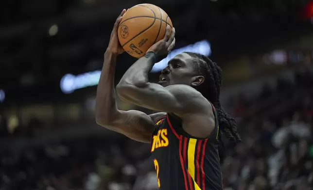 Atlanta Hawks guard Keaton Wallace (2) sinks a three-point shot during the first half of an NBA basketball game against the Chicago Bulls, Wednesday, Jan. 15, 2025, in Chicago. (AP Photo/Erin Hooley)