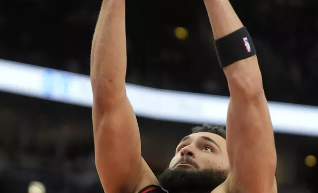 Atlanta Hawks forward David Roddy (8) makes a shot during the first half of an NBA basketball game against the Chicago Bulls, Wednesday, Jan. 15, 2025, in Chicago. (AP Photo/Erin Hooley)
