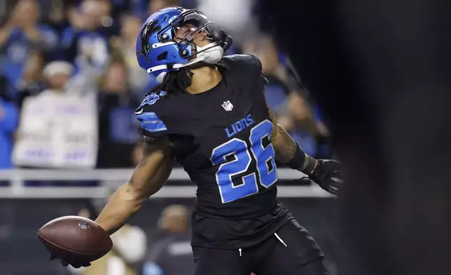 Detroit Lions running back Jahmyr Gibbs (26) celebrates his touchdown catch against the Minnesota Vikings during the second half of an NFL football game Sunday, Jan. 5, 2025, in Detroit. (AP Photo/Rey Del Rio)