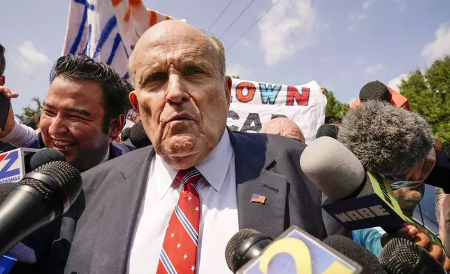 FILE - Rudy Giuliani speaks outside the Fulton County jail in Atlanta, on Wednesday, Aug. 23, 2023. (AP Photo/Brynn Anderson, File)