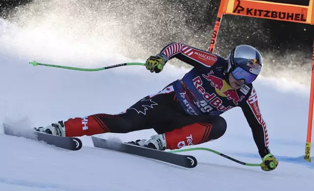 Canada's James Crawford speeds down the course during an alpine ski, men's World Cup downhill, in Kitzbühel, Austria, Saturday, Jan. 25, 2025. (AP Photo/Marco Trovati)