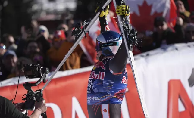 Canada's James Crawford reacts after completing an alpine ski, men's World Cup downhill in Kitzbühel, Austria, Saturday, Jan. 25, 2025. (AP Photo/Giovanni Auletta)