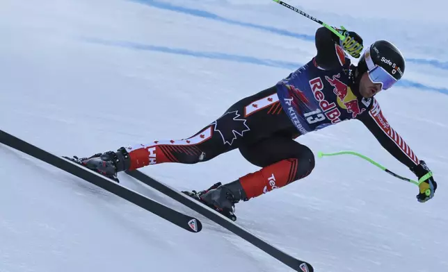 Canada's Cameron Alexander speeds down the course during an alpine ski, men's World Cup downhill, in Kitzbühel, Austria, Saturday, Jan. 25, 2025. (AP Photo/Marco Trovati)