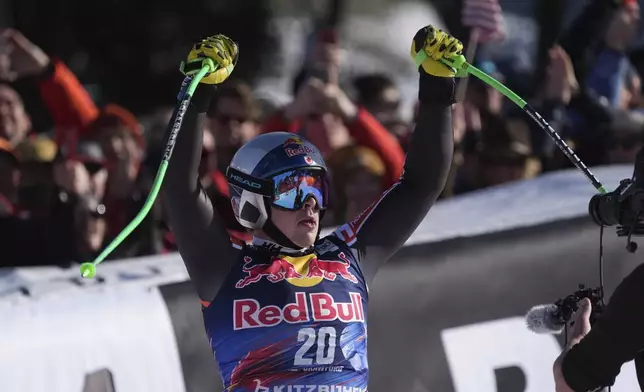 Canada's James Crawford reacts after completing an alpine ski, men's World Cup downhill in Kitzbühel, Austria, Saturday, Jan. 25, 2025. (AP Photo/Giovanni Auletta)