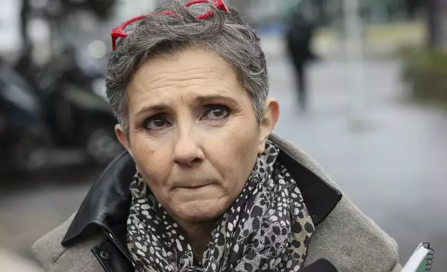 Dominique Pelicot 's lawyer Beatrice Zavarro answers reporters outside the Nanterre courthouse where the convicted rapist who horrified France by drugging his then wife, Gisele Pélicot, so other men could rape her, is now caught up in other cases, Thursday, Jan. 30, 2025 in Nanterre, outside Paris. (AP Photo/Thomas Padilla)