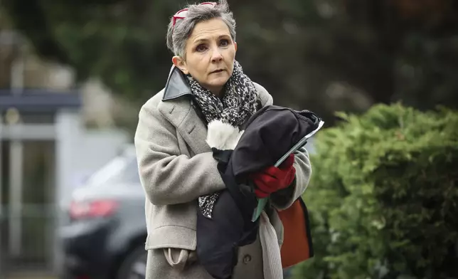 Dominique Pelicot 's lawyer Beatrice Zavarro arrives to answer reporters outside the Nanterre courthouse where the convicted rapist who horrified France by drugging his then wife, Gisele Pélicot, so other men could rape her, is now caught up in other cases, Thursday, Jan. 30, 2025 in Nanterre, outside Paris. (AP Photo/Thomas Padilla)