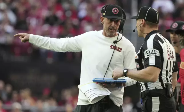 San Francisco 49ers head coach Kyle Shanahan argues a call with an official during the first half of an NFL football game against the Arizona Cardinals in Glendale, Ariz., Sunday, Jan. 5, 2025. (AP Photo/Rick Scuteri)