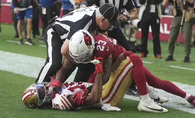 Arizona Cardinals cornerback Sean Murphy-Bunting (23) scuffles with San Francisco 49ers wide receiver Jauan Jennings (15) during the first half of an NFL football game in Glendale, Ariz., Sunday, Jan. 5, 2025. (AP Photo/Ross D. Franklin)