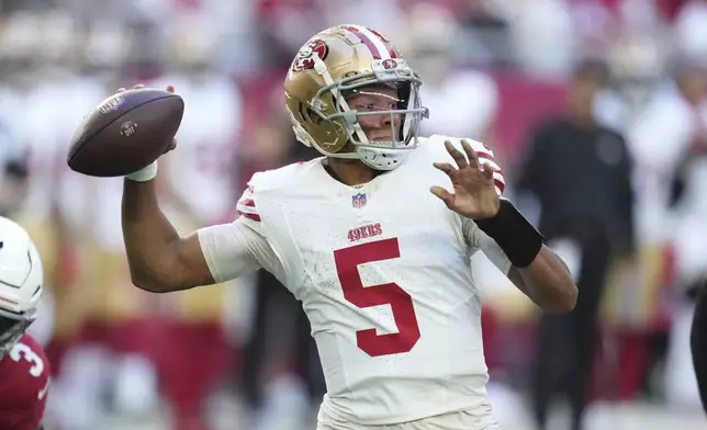 San Francisco 49ers quarterback Joshua Dobbs (5) looks to pass against the Arizona Cardinals during the first half of an NFL football game in Glendale, Ariz., Sunday, Jan. 5, 2025. (AP Photo/Ross D. Franklin)