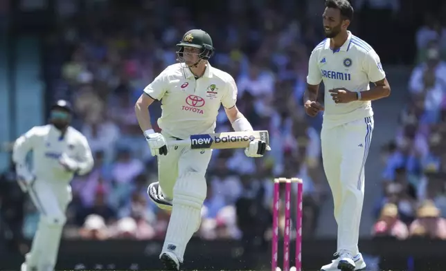 Australia's Steve Smith takes a run during play on the second day of the fifth cricket test between India and Australia at the Sydney Cricket Ground, in Sydney, Australia, Saturday, Jan. 4, 2025. (AP Photo/Mark Baker)