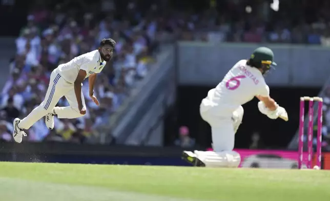 India's Mohammed Siraj bowls to Australia's Sam Konstas during play on the second day of the fifth cricket test between India and Australia at the Sydney Cricket Ground, in Sydney, Australia, Saturday, Jan. 4, 2025. (AP Photo/Mark Baker)