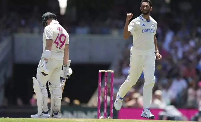 India's Prasidh Krishna, right, reacts after dismissing Australia's Steve Smith during play on the second day of the fifth cricket test between India and Australia at the Sydney Cricket Ground, in Sydney, Australia, Saturday, Jan. 4, 2025. (AP Photo/Mark Baker)