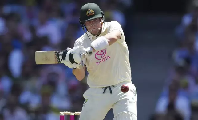 Australia's Steve Smith hits the ball for six runs during play on the second day of the fifth cricket test between India and Australia at the Sydney Cricket Ground, in Sydney, Australia, Saturday, Jan. 4, 2025. (AP Photo/Mark Baker)