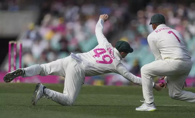 Australia's Steve Smith dives as he attempts to take a catch during play on the second day of the fifth cricket test between India and Australia at the Sydney Cricket Ground, in Sydney, Australia, Saturday, Jan. 4, 2025. (AP Photo/Mark Baker)