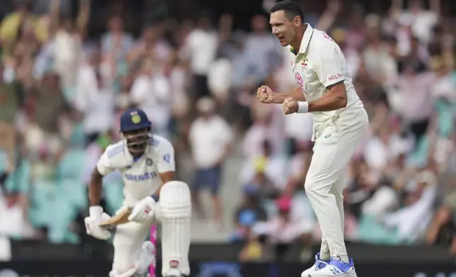 Australia's Scott Boland reacts after taking a the wicket of India's Nitish Kumar Reddy during play on the second day of the fifth cricket test between India and Australia at the Sydney Cricket Ground, in Sydney, Australia, Saturday, Jan. 4, 2025. (AP Photo/Mark Baker)