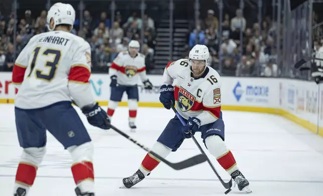 Florida Panthers center Aleksander Barkov (16) moves the puck up the ice against the Utah Hockey Club during the second period of an NHL hockey game, Wednesday, Jan. 8, 2025, in Salt Lake City. (AP Photo/Melissa Majchrzak)