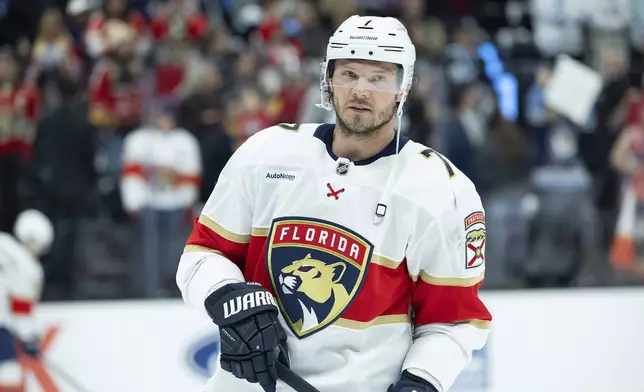 Florida Panthers defenseman Dmitry Kulikov looks on from the ice during the warmups of an NHL hockey game against the Utah Hockey Club, Wednesday, Jan. 8, 2025, in Salt Lake City. (AP Photo/Melissa Majchrzak)