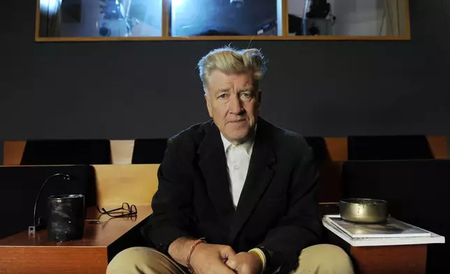 FILE - Filmmaker David Lynch poses for a portrait in his private screening room in Los Angeles on Sept. 9, 2010. (AP Photo/Chris Pizzello, file)