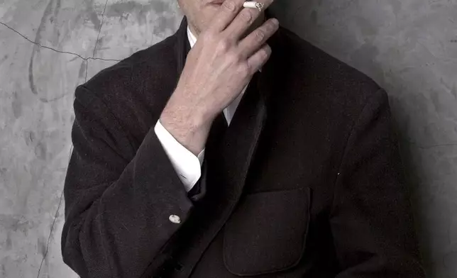 FILE - Filmmaker David Lynch poses at his Los Angeles home March 14, 2002. (AP Photo/Chris Weeks, File)